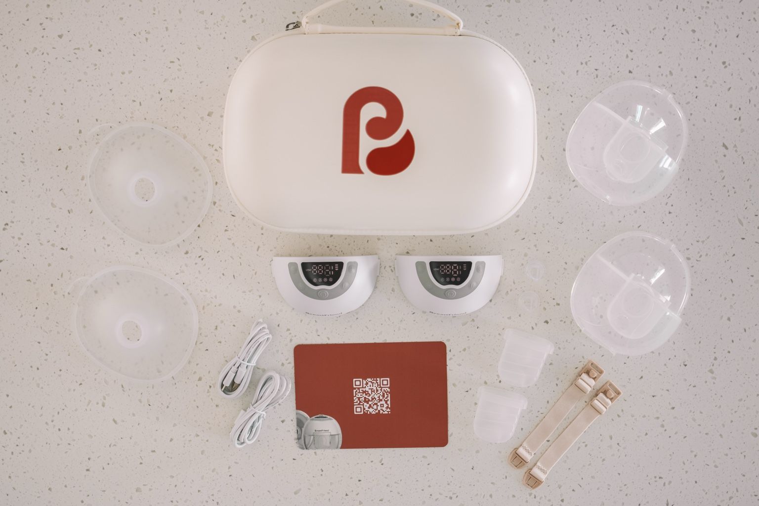 Breastie breast pumps from the Breastfriend disassembled, case with red logo 
